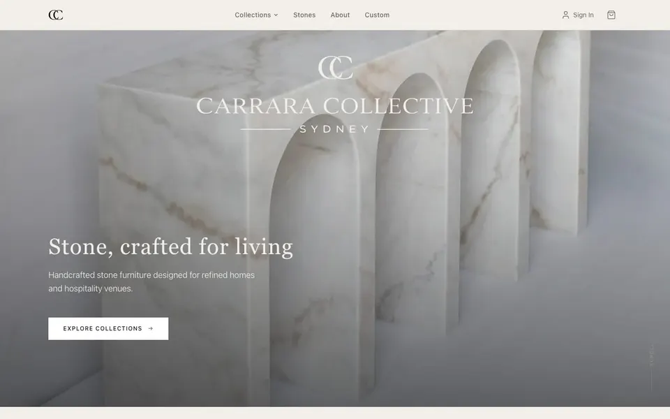 The Carrara Collective shop homepage, with a full-width marble hero and an Explore Collections button.