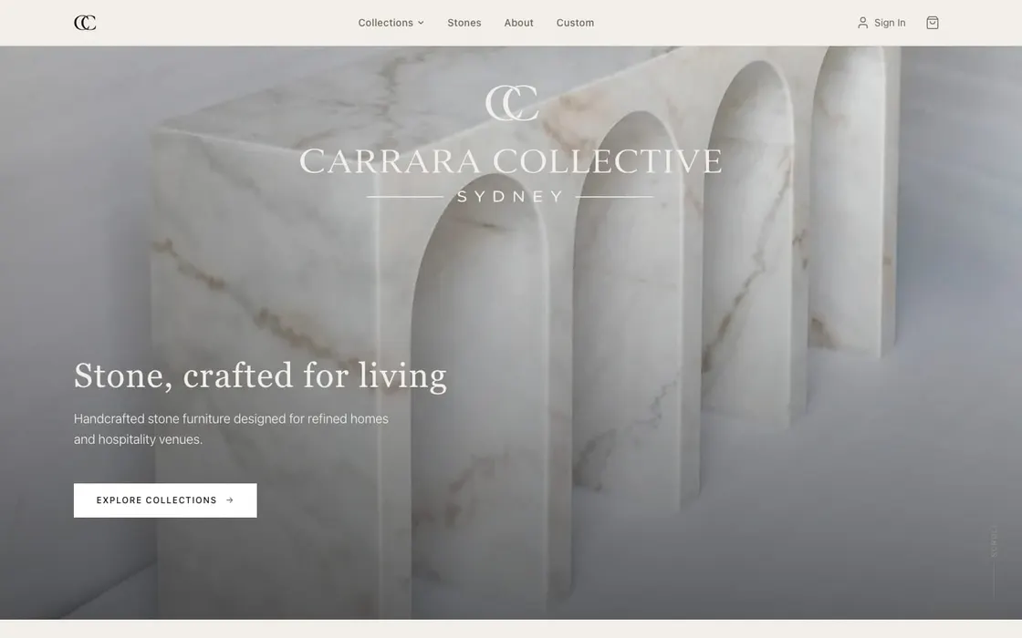 The Carrara Collective shop homepage, with a full-width marble hero and an Explore Collections button.